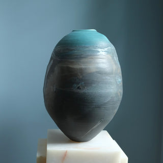 Handmade sculptural ceramic vessel from the Earth, Moon, Magma Collection by EBW Ceramics with textured volcanic glaze and organic form