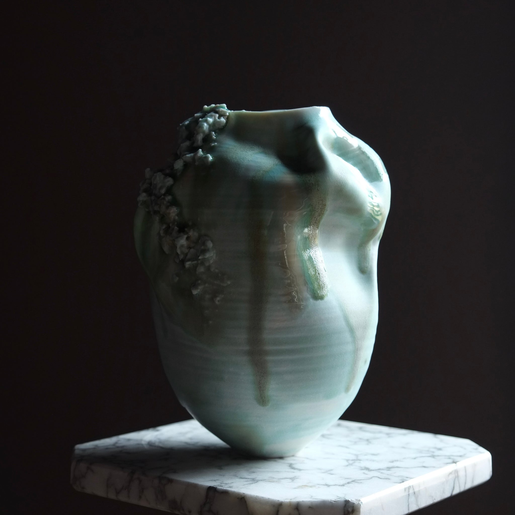 Blue Ceramic vase with floral design on a dark background