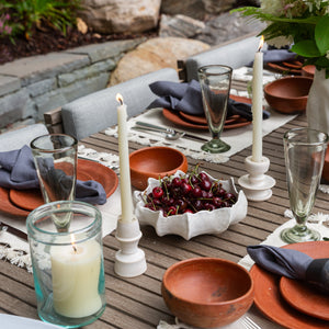 bowl with cherries on table and placemats