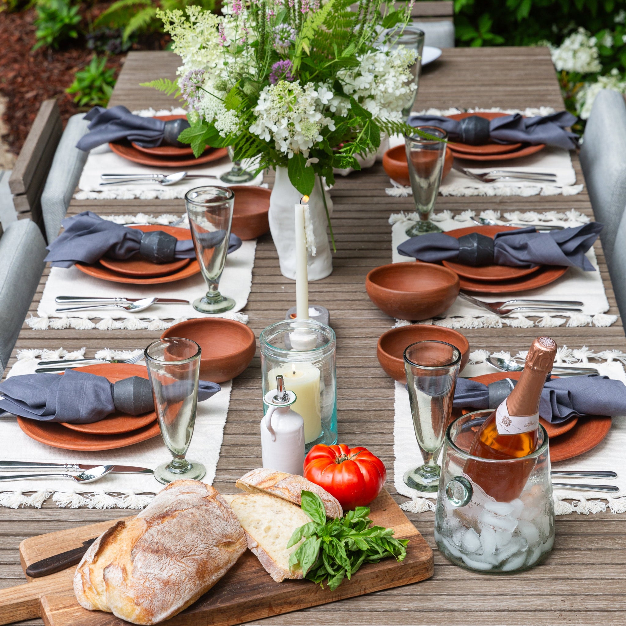 table setting outside with dishes 