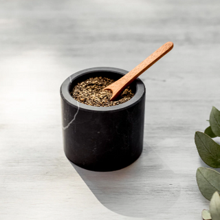 marble pepper cellar with wooden spoon 