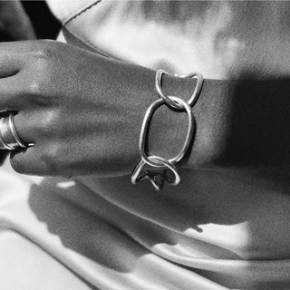 Close-up of a hand wearing a sterlling silver bracelet with toggle  